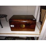 A Victorian mahogany writing box with one inkwell.