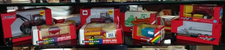 10 boxed Britain's 1/32 scale farm tractors and implements