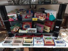 A mixed collection over 3 shelves, of boxed Diecast including Lledo and Matchbox etc. (Some in the
