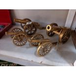 Two pairs of solid brass cannons.