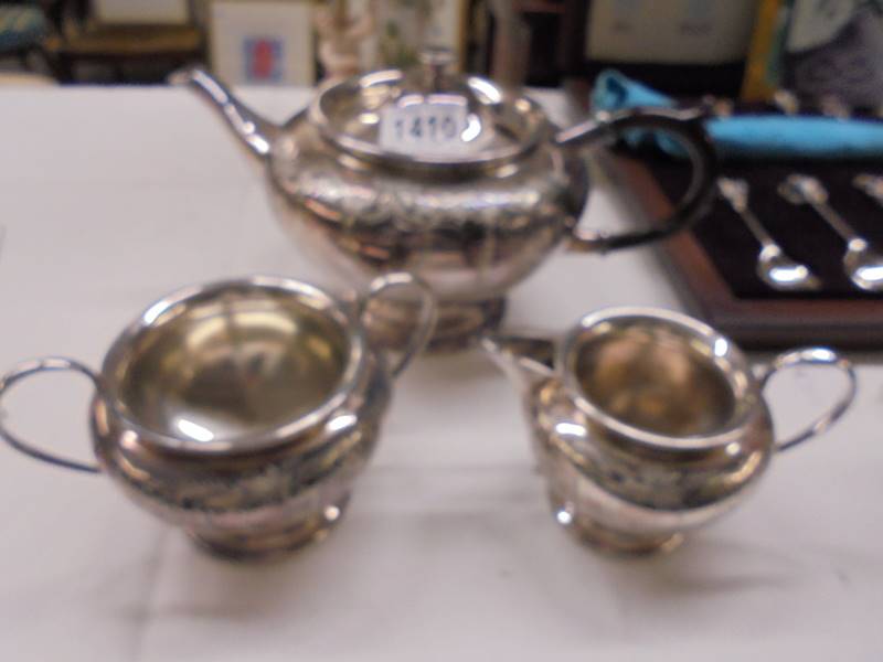 A three piece silver plate tea set. - Image 3 of 3