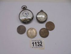 A lady's silver fob watch, a pocket watch and four coins.