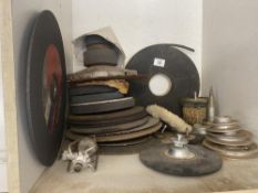 A mixed lot of cutting and grinding discs and saw blades, pulleys and arbours.