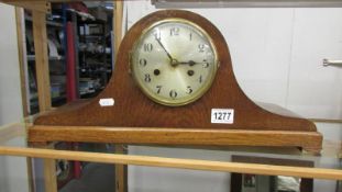 An oak eight day mantel clock.