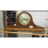 An oak eight day mantel clock.