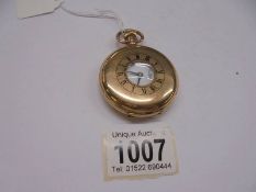 A gold plated half hunter pocket watch.