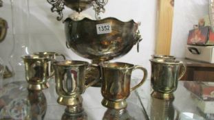 A silver plate punch bowl and six half pint tankards..