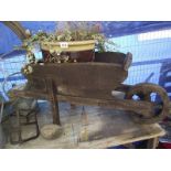 A working ornamental wheel barrow and a potted vine. COLLECT ONLY.