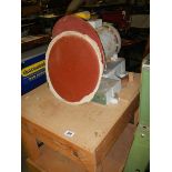 A bench sander with disc.