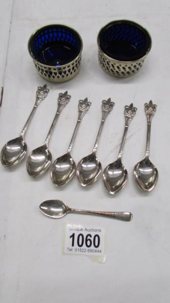 Six Boy Scout spoons, one other and a pair of silver plate salts with blue glass liners.