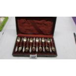 A cased set of twelve silver spoons.