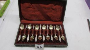 A cased set of twelve silver spoons.