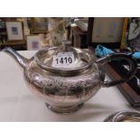 A three piece silver plate tea set.