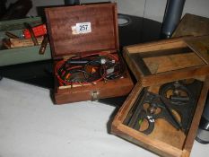 A collection of welding nozzles and control equipment and rods.