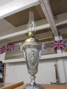 A Victorian silver plated oil lamp with diamond lozenge marke for 23 April 1881. COLLECT ONLY.