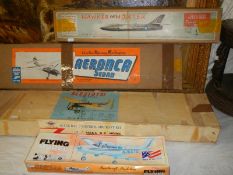 Four model aircraft kits including Hawker Hunter, Mercury and two others.