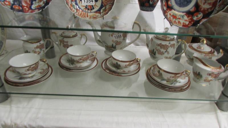 Twenty pieces of Japanese fine porcelain hand painted tea ware.