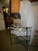 A Victorian iron baby crib with brass fitting. COLLECT ONLY.