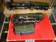 A Trix twin railway BR Brittania clas Pacific and a boxed 4-6-0 class V loco and tender.