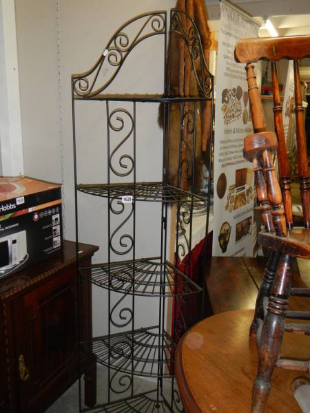 A set of metal flat pack corner shelves. COLLECT ONLY.