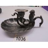 A Victorian silver plate chamber candlestick with mounted owl vesta match holder.