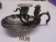 A Victorian silver plate chamber candlestick with mounted owl vesta match holder.