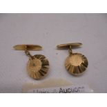 A pair of gold 'Russian' cuff links, marked 25, test as 18ct gold. 5.6 grams.