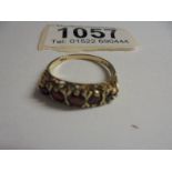 A five stone garnet ring in 9ct gold, size P