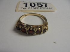 A five stone garnet ring in 9ct gold, size P