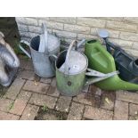 2 galvenised steel watering cans and 2 plastic. Collect Only.