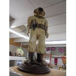 A resin figure of a diver. COLLECT ONLY.