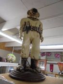 A resin figure of a diver. COLLECT ONLY.