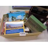A mixed lot of postcards and a Viewmaster viewer.