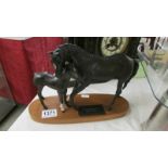 A Royal Doulton Black Beauty with foal.