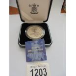 A cased 2000 silver proof £1 fine silver Britannia coin with certificate.