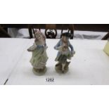 A pair of continental porcelain figures, 16 cm.