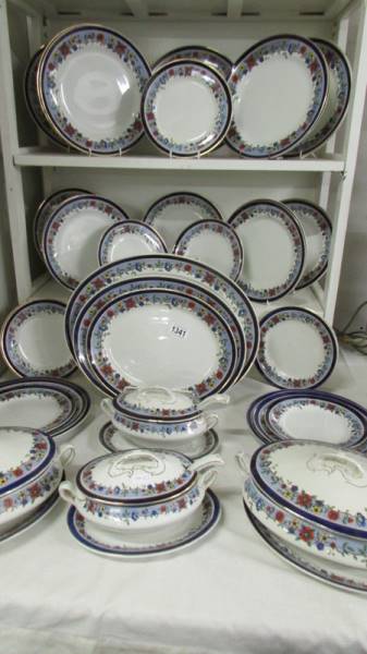 In excess of 40 pieces of Newport Pottery dinner ware.