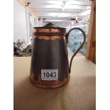 An unmarked W A S Benson one pint insulated copper hot water jug.