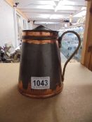 An unmarked W A S Benson one pint insulated copper hot water jug.