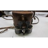 A cased pair of WW1 French Hunsicker & Alexis military issue binoculars.
