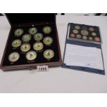A cased set of 12 22ct gold plated Racing Legends medallions by Graham Isam for Danbury Mint and a