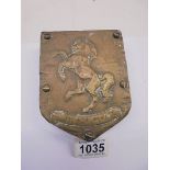 A brass Aveling Warford Invicta wall plaque.