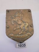 A brass Aveling Warford Invicta wall plaque.