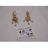 A pair of 18ct gold pendant earrings set pearls, total weight 4 grams.