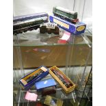 Four Hornby Dublo boxed locos, two shelves.