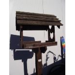 A wooden bird table with heart cut aways. COLLECT ONLY.