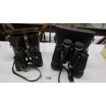 A cased pair of Pathescope 10 x 50 binoculars and a cased pair of Delacroix, Paris 7 x 35