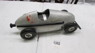 A vintage Woodette's Winzeler compressed air powered car, made in Chicago, USA. 33 cm long.