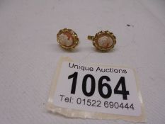 A pair of 18ct gold cameo earrings, total weight 4.2 grams.