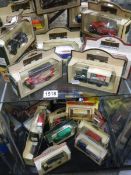 26 Days Gone and Models of Yesteryear die cast vehicles, two shelves.